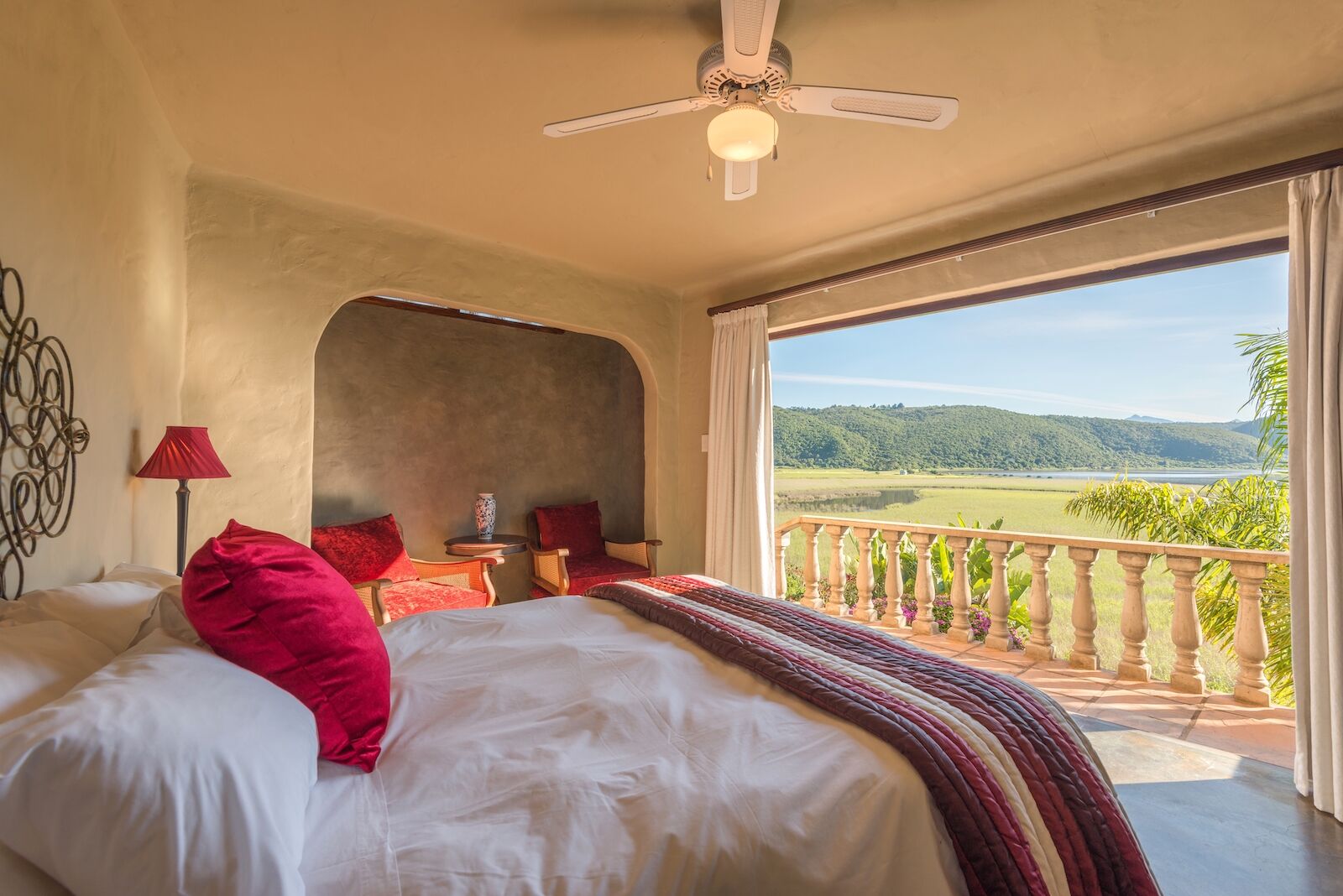 bed in airbnb looking over open field